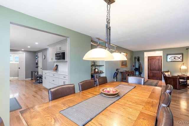117 Shoreview Dr, Clay, NY 13090 - dining space with light wood-type flooring, baseboards, and recessed lighting