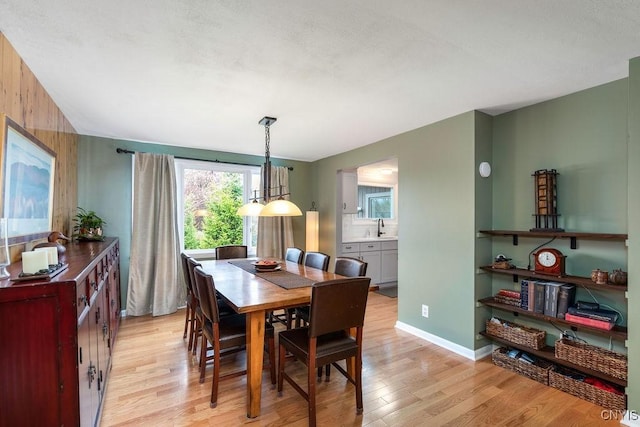117 Shoreview Dr, Clay, NY 13090 - dining area with light wood-style flooring and baseboards
