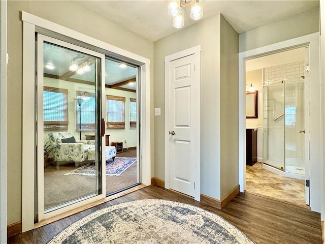 155 Hickory Grove Rd, Horseheads, NY 14845 - entryway featuring wood finished floors, baseboards, and a chandelier