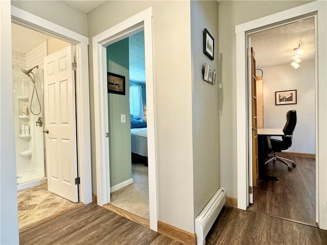 155 Hickory Grove Rd, Horseheads, NY 14845 - corridor with a baseboard heating unit, dark wood-type flooring, an office area, and baseboards