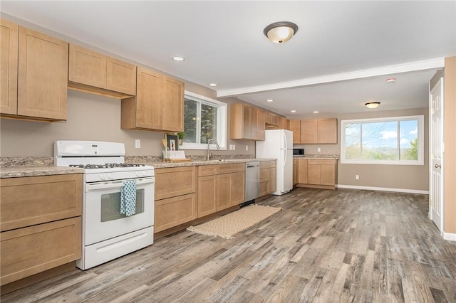 kitchen featuring white appliances, light brown cabinets, light wood finished floors, baseboards, and recessed lighting