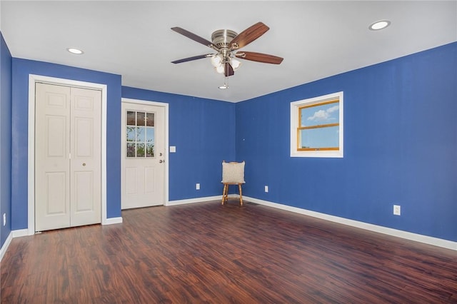 unfurnished bedroom with baseboards, wood finished floors, recessed lighting, a closet, and a ceiling fan