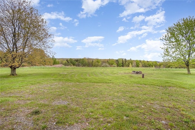 view of grassy yard with a view of countryside