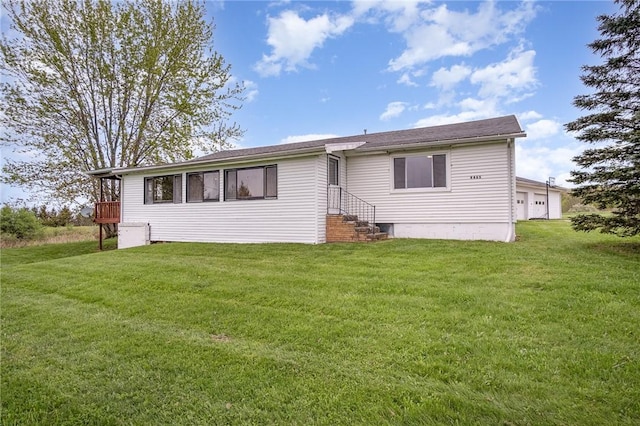 rear view of property with a yard