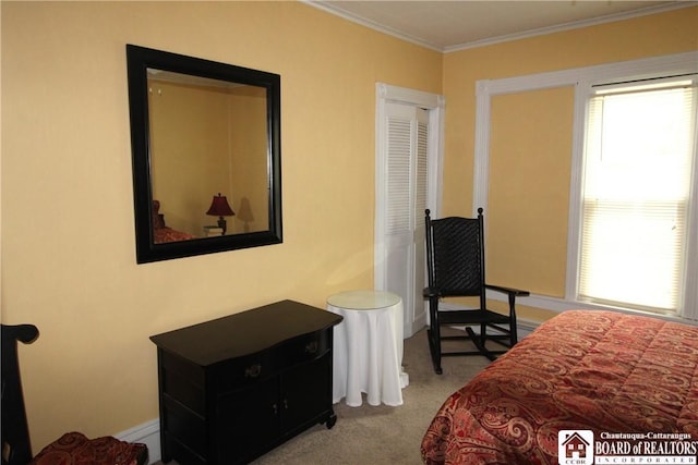 carpeted bedroom with ornamental molding