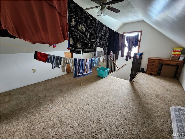 additional living space featuring carpet flooring, a ceiling fan, and lofted ceiling