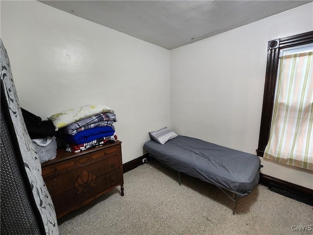 bedroom with carpet and baseboards