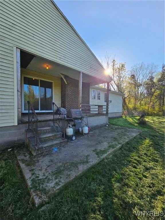 3159 Upper Mountain Rd, Cambria, NY 14132 - back of property with a yard and brick siding
