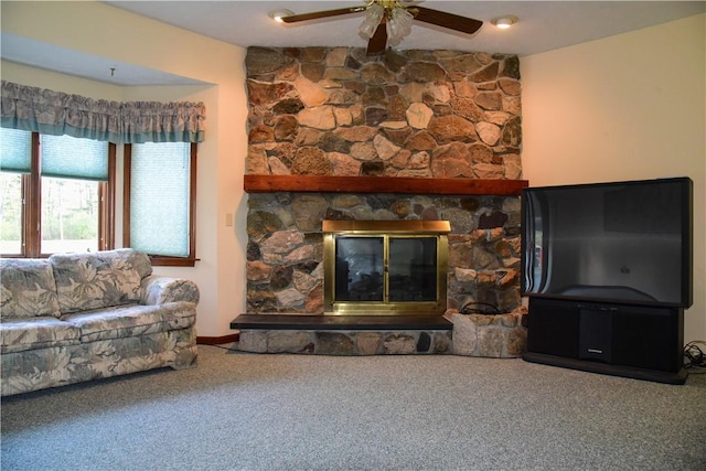 1142 W Ave, Clarkson, NY 14420 - carpeted living area with a ceiling fan and a stone fireplace