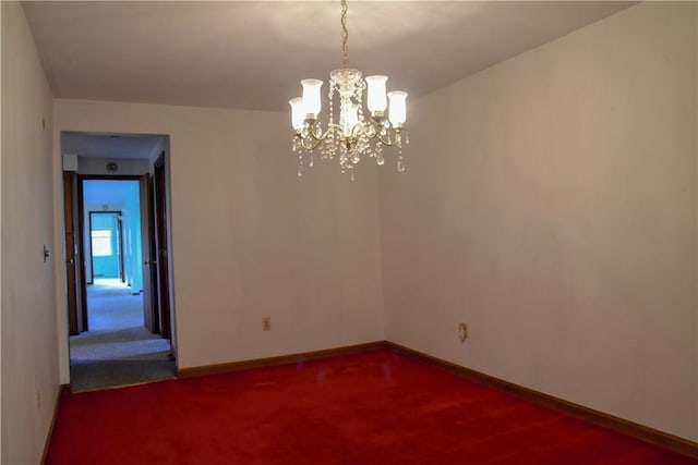 1142 W Ave, Clarkson, NY 14420 - empty room with a chandelier, baseboards, and carpet floors