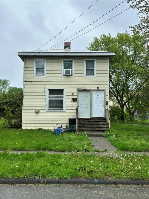 312 Broadway St, Elmira-City, NY 14904 - back of property featuring entry steps and a chimney