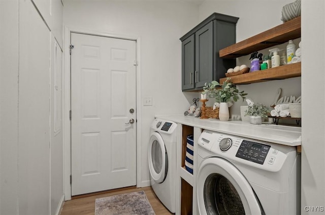 161 Knapps Knolle Rd, Schuyler, NY 13502 - washroom featuring independent washer and dryer, cabinet space, and light wood-type flooring