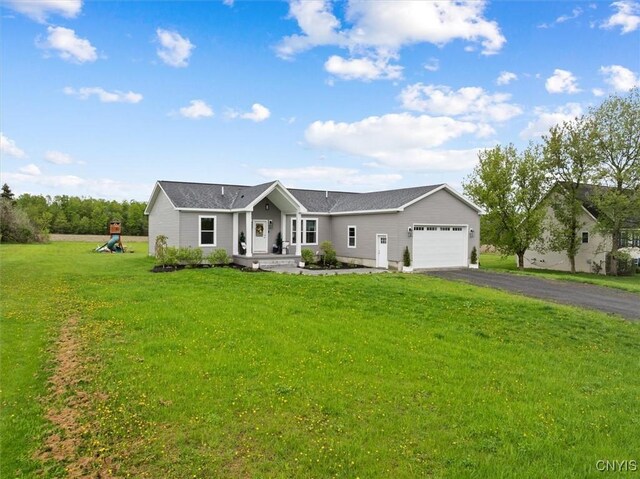 161 Knapps Knolle Rd, Schuyler, NY 13502 - single story home with a garage, asphalt driveway, and a front yard