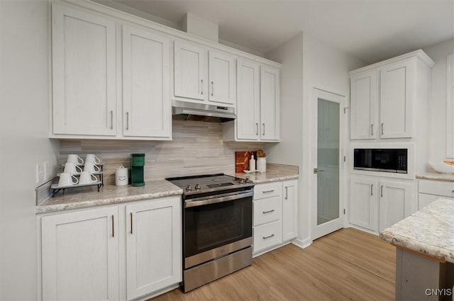161 Knapps Knolle Rd, Schuyler, NY 13502 - kitchen featuring stainless steel electric range, built in microwave, under cabinet range hood, light wood finished floors, and white cabinetry