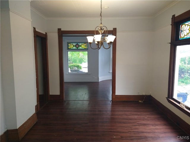 406 Milton Ave, Syracuse, NY 13204 - unfurnished dining area with a chandelier, wood finished floors, baseboards, and ornamental molding