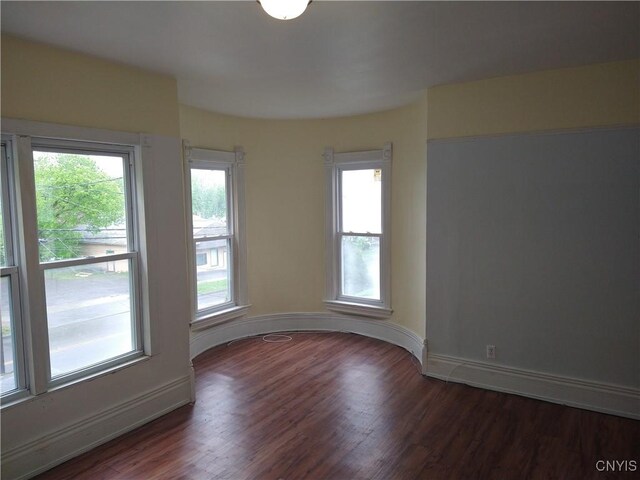406 Milton Ave, Syracuse, NY 13204 - unfurnished room with wood finished floors and baseboards