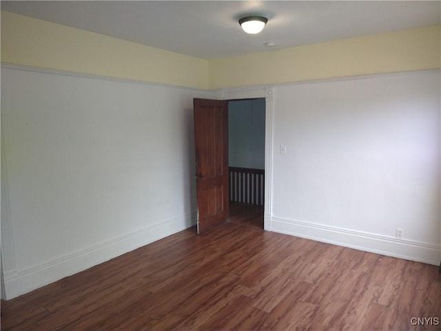 406 Milton Ave, Syracuse, NY 13204 - empty room featuring wood finished floors and baseboards