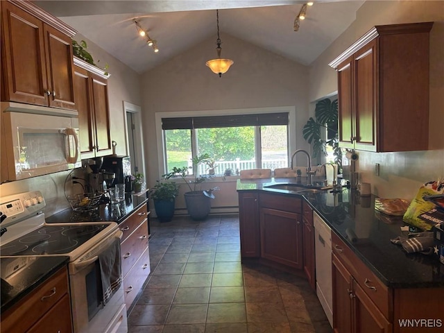 kitchen with white appliances, a sink, lofted ceiling, a baseboard heating unit, and hanging light fixtures