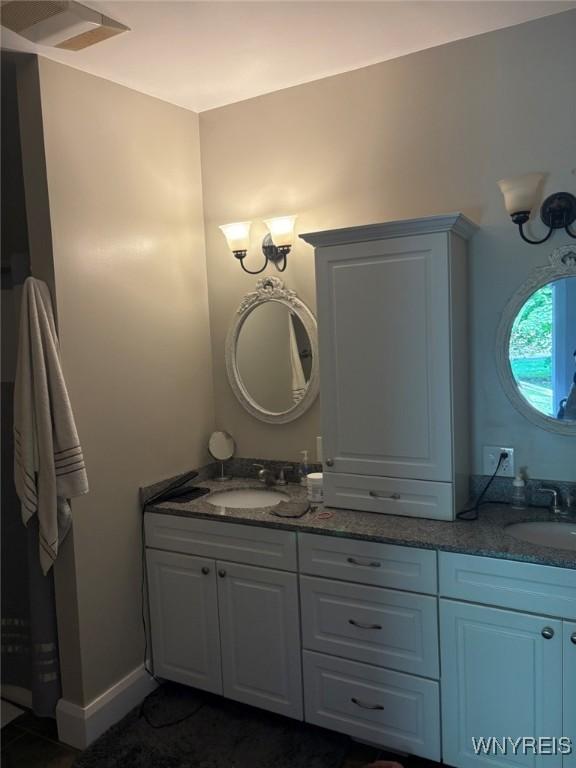 bathroom featuring double vanity