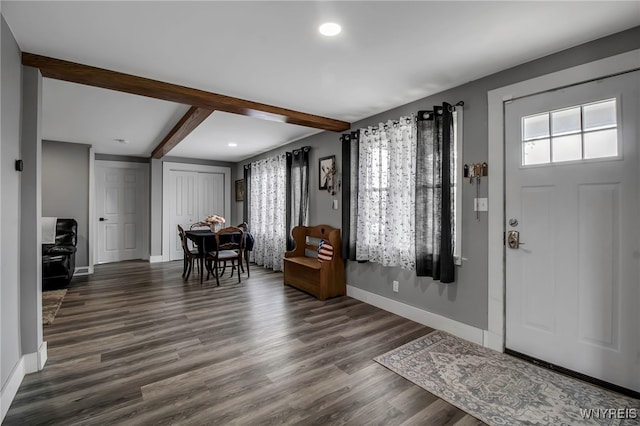 entrance foyer with baseboards, beamed ceiling, wood finished floors, and recessed lighting
