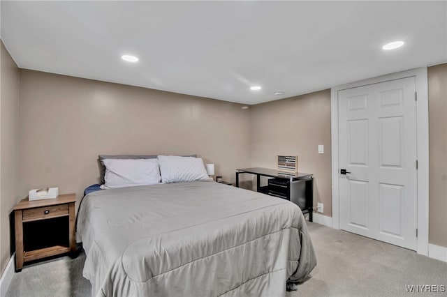 carpeted bedroom featuring baseboards and recessed lighting