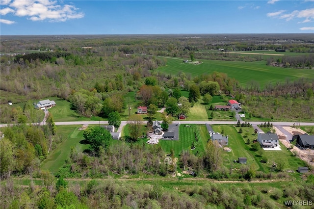 aerial view of property's location with a heavily wooded area