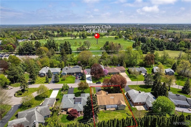 aerial perspective of suburban area with property parcel outlined and a tree filled landscape