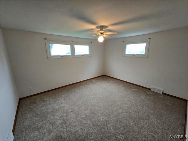 585 Downing St, Buffalo, NY 14220 - carpeted spare room with a ceiling fan and baseboards