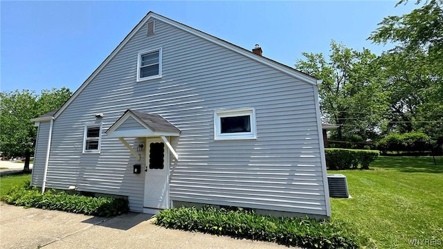 585 Downing St, Buffalo, NY 14220 - view of front of property with a front yard and a chimney