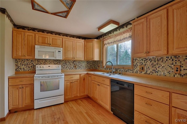 43 County Rte 9, Rossie, NY 13642 - kitchen with white appliances, a sink, light countertops, and light wood-type flooring