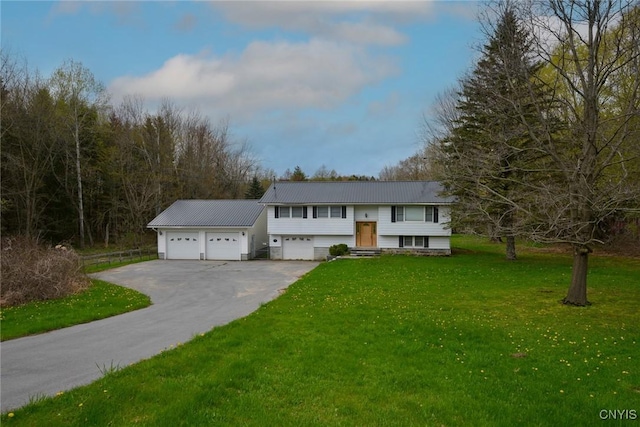 43 County Rte 9, Rossie, NY 13642 - split foyer home with a garage, a front yard, metal roof, and driveway