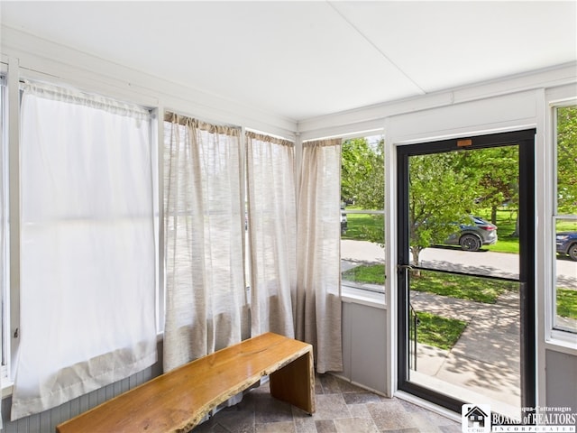 sunroom with stone finish floors