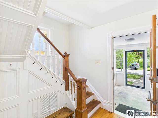 stairs with wood finished floors