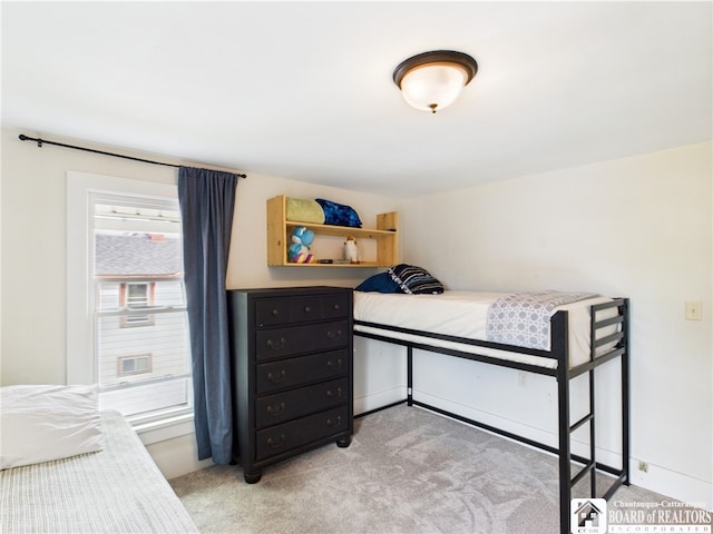 bedroom with light carpet
