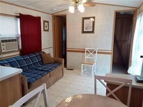 1984-2008 S Genesee St, Montour, NY 14865 - living room featuring a ceiling fan, plenty of natural light, vaulted ceiling, and cooling unit