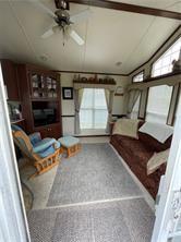 1984-2008 S Genesee St, Montour, NY 14865 - unfurnished living room with ceiling fan
