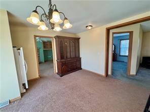 1984-2008 S Genesee St, Montour, NY 14865 - unfurnished dining area with a chandelier, carpet flooring, and baseboards