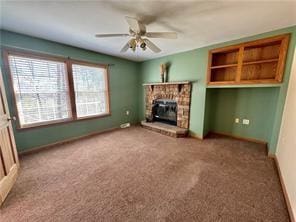 1984-2008 S Genesee St, Montour, NY 14865 - unfurnished living room with carpet, ceiling fan, a glass covered fireplace, and baseboards