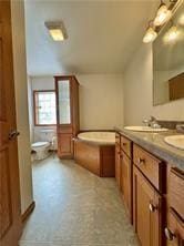 1984-2008 S Genesee St, Montour, NY 14865 - full bath featuring toilet, double vanity, and a garden tub