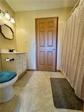 1984-2008 S Genesee St, Montour, NY 14865 - full bathroom with toilet, baseboards, a shower with curtain, and vanity