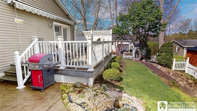 view of yard featuring fence and a deck