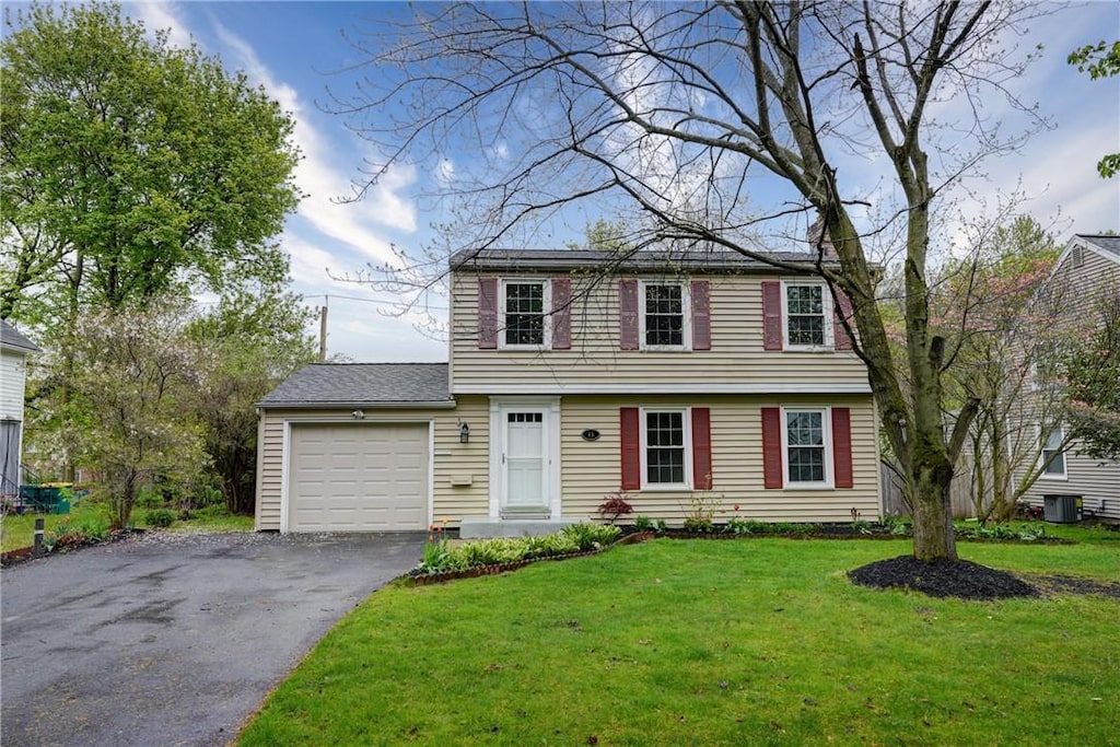 44 Brooklawn Dr, Brighton, NY 14618 - colonial house featuring an attached garage, asphalt driveway, a front yard, and central AC