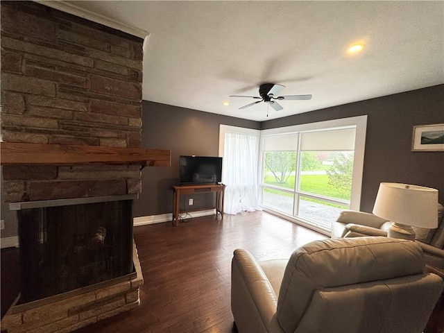 5 Walnut Street Ext, Sennett, NY 13021 - living area featuring a ceiling fan, baseboards, dark wood finished floors, and a fireplace
