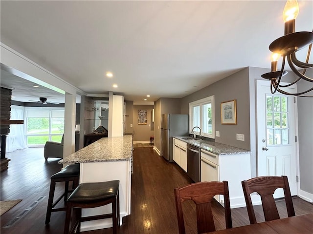 5 Walnut Street Ext, Sennett, NY 13021 - kitchen featuring stainless steel appliances, a sink, recessed lighting, baseboards, and dark wood finished floors