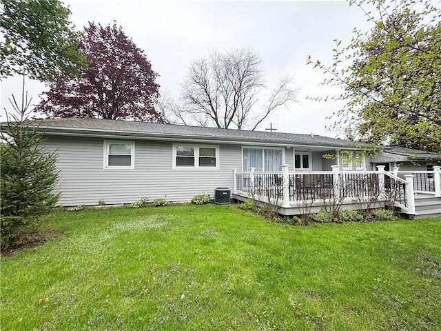 5 Walnut Street Ext, Sennett, NY 13021 - rear view of property featuring a wooden deck, cooling unit, and a lawn