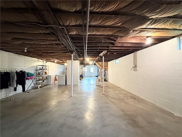 unfinished basement with washing machine and dryer