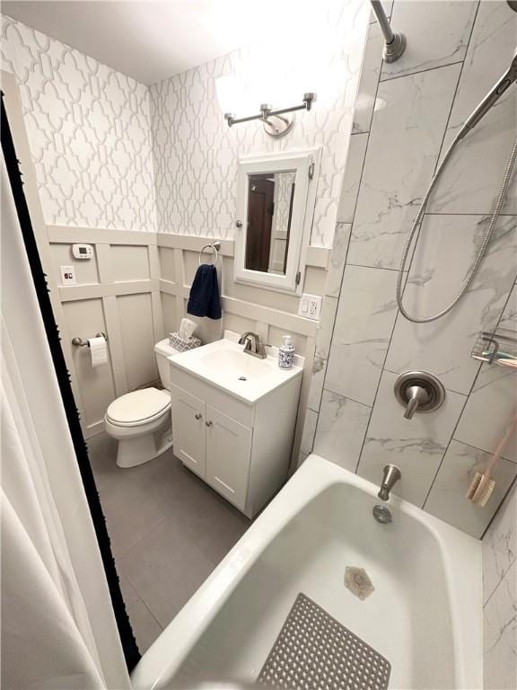 bathroom featuring wallpapered walls, toilet, shower / bathtub combination, and vanity