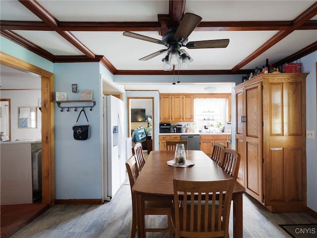 dining space featuring a ceiling fan, light wood-type flooring, ornamental molding, and baseboards