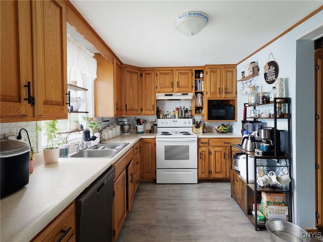 kitchen featuring white electric range, dishwasher, a sink, under cabinet range hood, and black microwave
