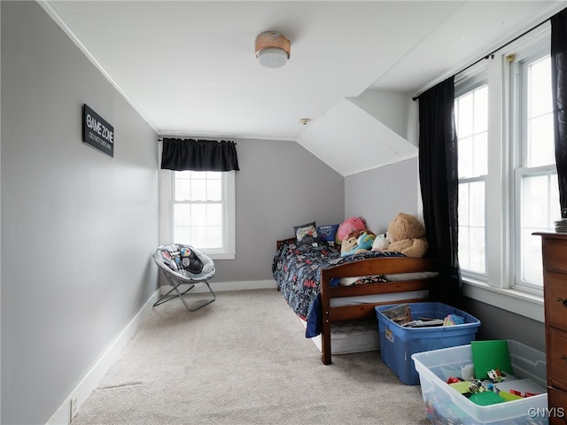 bedroom featuring carpet flooring, baseboards, and vaulted ceiling